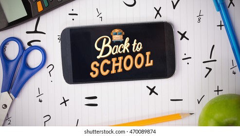 back to school against students table with school supplies