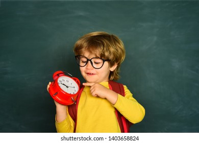 Back To School. Alarm Clock Anxiety. Late. Kid Boy Holding Clock Alarm