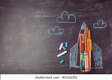 Back to school background with rocket made from pencils. View from above - Powered by Shutterstock