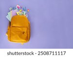 Back to school, school bazaar, school accessories sale background. Bright color background with school supplies, bag, notepads, pens, books, bags with pencil stand, backpack, pencil case copy space