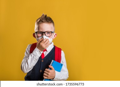 Back To School. School Boy In Uniform And Protection Mask Isolated On Yellow. Concept Of Coronavirus. 