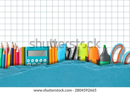Back to school, Collection of school supplies spread on graph paper background. Education concept.