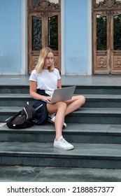 Back To School. Back To College,Girl Student Near College,university With Laptop.Education In College,Meeting Students.Beginning Of School Year At University National Day Of Knowledge