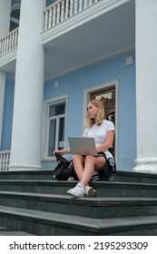 Back To School. Back To College,Girl Student Near College,university With Laptop.Education In College,Meeting Students.Beginning Of School Year At University National Day Of Knowledge