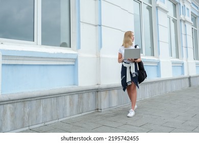 Back To School. Back To College,Girl Student Near College,university With Laptop.Education In College,Meeting Students.Beginning Of School Year At University National Day Of Knowledge