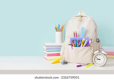 Back to school concept with backpack and stacks of books - Powered by Shutterstock