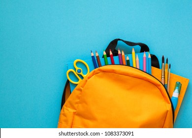 Back to school concept. Backpack with school supplies. Top view. Copy space - Shutterstock ID 1083373091