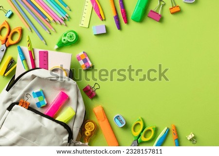 Back to school concept. Backpack with school supplies on color background.