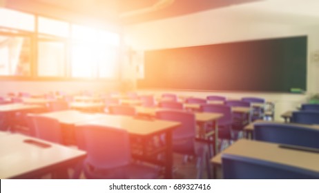 Back to school concept. Classroom in blur background without young student; Blurry view of elementary class room no kid or teacher with chairs and tables in campus.
