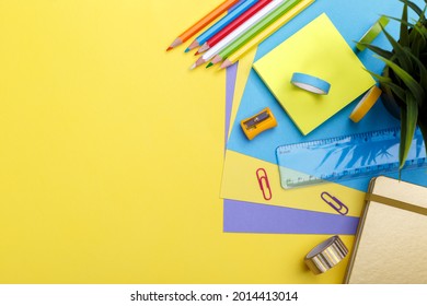 Back to school concept. Colorful stationary school supplies on yellow  background, space or text flat lay