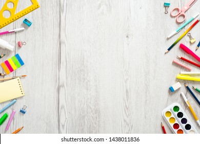 Back To School Concept, Creative Layout With With Various School Supplies On Wooden Desk Table. Flat Lay Style Composition, Top View, Overhead. 