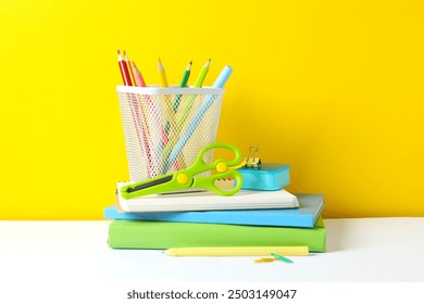 A back to school concept featuring various school supplies and notebooks