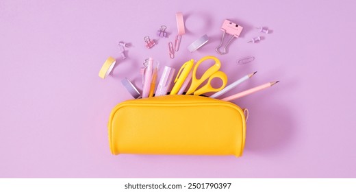 Back to school concept. Flat lay top view on full pencil case with pencils and pens with notepad isolated on pastel purple background. 
