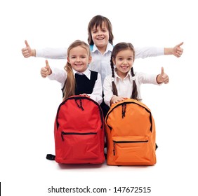 Back To School Concept With Happy Kids Giving Thumbs Up Sign - Isolated