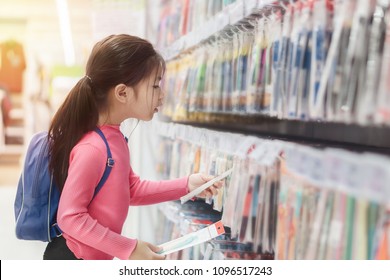 Back To School Concept, Little Asian Girl Or Pupil Buying School Supplies In Store, Selective Focus