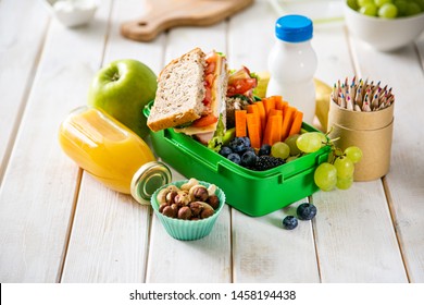 Back To School Concept - Lunch Box With Juice, Apple And Banana, Copy Space