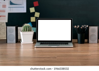 Back To School Concept. Mockup Blank Screen Laptop Computer And Supplies On Wooden Table.