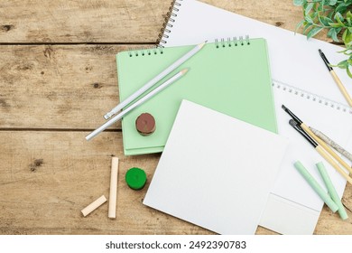 Back to school concept. Office eco friendly supplies, recycling materials, zero waste technologies. Wooden boards background, flat lay, top view - Powered by Shutterstock