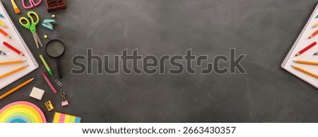 Back to school concept over classroom blackboard. Top view