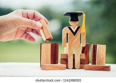 Back to School Concept, People Sign wood with Graduation celebrating cap on wooden square blocks tower blur hands. Blank space for letter e.g education, graduate. Ideas for international Educational