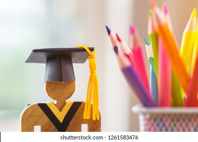 Back to School Concept, People Sign wood with Graduation celebrating cap blur pencil box, show alternative studying. Graduate or Education knowledge learning study abroad international Ideas.