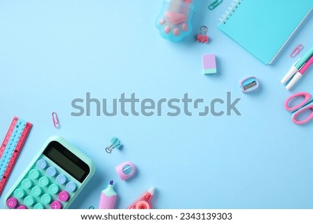 Back to school concept. Stylish school supplies on pastel blue background. Flat lay, top view.
