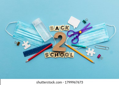 Back To School Concept. School Supplies With A Medical Face Mask