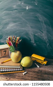 Back to school concept. School supplies, schoolbus and shopping cart with stuff