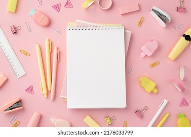 Back to school concept. Top view photo of notepads pens ice cream shaped sharpeners ruler staplers clips adhesive tape markers and pineapple shaped erasers on isolated pink background with copyspace - Shutterstock ID 2176033799