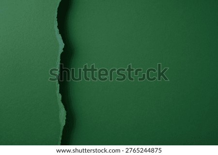 Back to school concept with torn green paper and textured background ideal for banners, posters, flyers, notebook covers and stationery design offering copyspace for announcements and seasonal promotions
