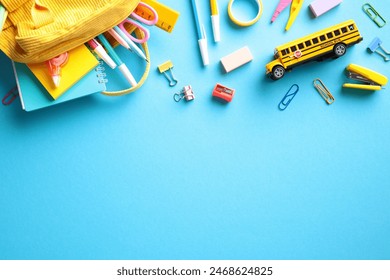 Back to school concept with vibrant school supplies on blue background. Flat lay, top view, copy space. - Powered by Shutterstock