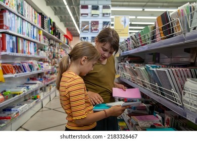 Back To School Concept,Two Girls Or Pupils Buying School Supplies In Store, Selective Focus