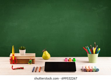 Back To School Concepty With Clear Blackboard Background, Desk, Items