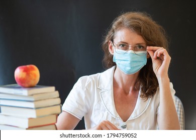 Back To School During Covid Pandemics Teacher With Face Mask