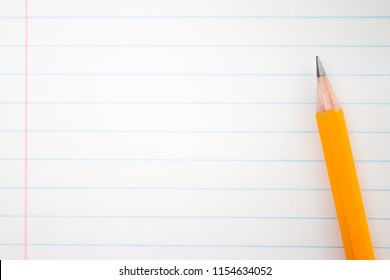 Back to school, education concept - orange pencils close up and composition book on background for educational new academic year begin or study term start. Mock-up Copy space