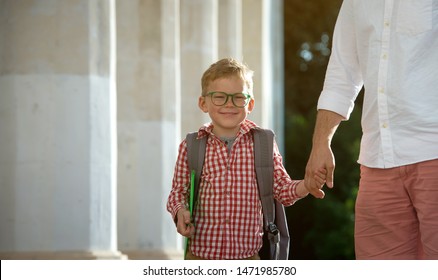 Back To School. Father Leaves Child In School Building. First Day Of Fall. Dad Saying Goodbye To Son. Parent Leads Child To Study. 