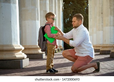 Back To School. Father Leaves Child In School Building. First Day Of Fall. Dad Saying Goodbye To Son. Parent Leads Child To Study. 