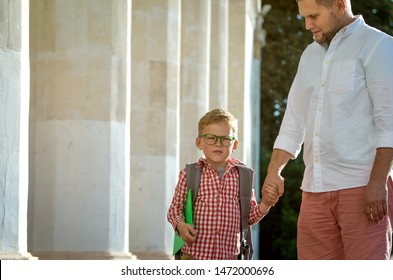 Back To School. Father Leaves Child In School Building. First Day Of Fall. Dad Saying Goodbye To Son. Parent Leads Child To Study. 