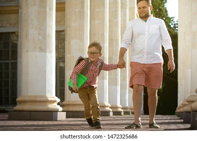 Back To School. Father Leaves Child In School Building. First Day Of Fall. Dad Saying Goodbye To Son. Parent Leads Child To Study. 