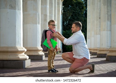 Back To School. Father Leaves Child In School Building. First Day Of Fall. Dad Saying Goodbye To Son. Parent Leads Child To Study. 