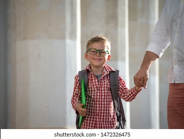 Back To School. Father Leaves Child In School Building. First Day Of Fall. Dad Saying Goodbye To Son. Parent Leads Child To Study. 