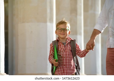 Back To School. Father Leaves Child In School Building. First Day Of Fall. Dad Saying Goodbye To Son. Parent Leads Child To Study. 