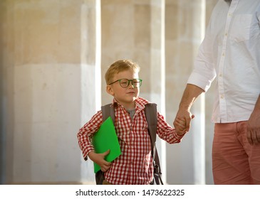 Back To School. Father Leaves Child In School Building. First Day Of Fall. Dad Saying Goodbye To Son. Parent Leads Child To Study. 