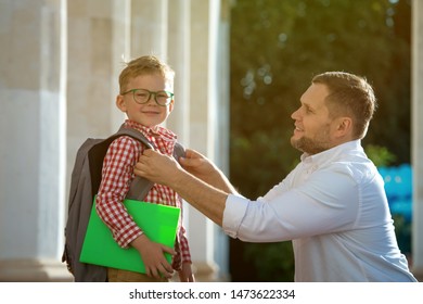 Back To School. Father Leaves Child In School Building. First Day Of Fall. Dad Saying Goodbye To Son. Parent Leads Child To Study. 