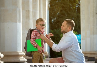 Back To School. Father Leaves Child In School Building. First Day Of Fall. Dad Saying Goodbye To Son. Parent Leads Child To Study. 