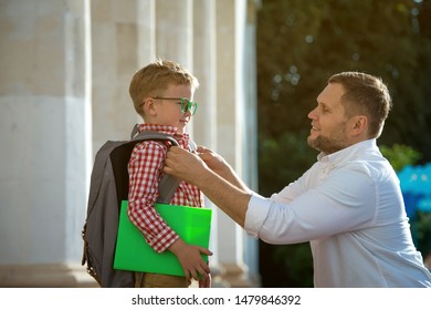 Back To School. Father Leaves Child In School Building. First Day Of Fall. Dad Saying Goodbye To Son. Parent Leads Child To Study. 