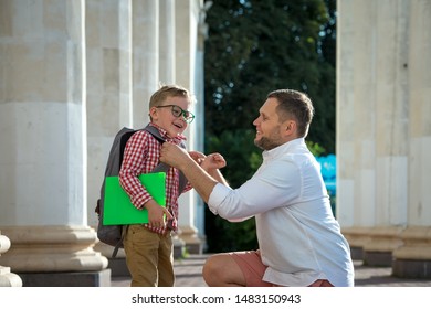 Back To School. Father Leaves Child In School Building. First Day Of Fall. Dad Saying Goodbye To Son. Parent Leads Child To Study. 