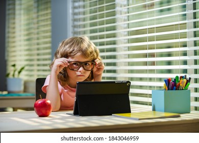 Back To School. First Day At School. Cute Little Boy Child Using Laptop Computer, Studying Through Online E-learning System. Kids Education, Knowledge