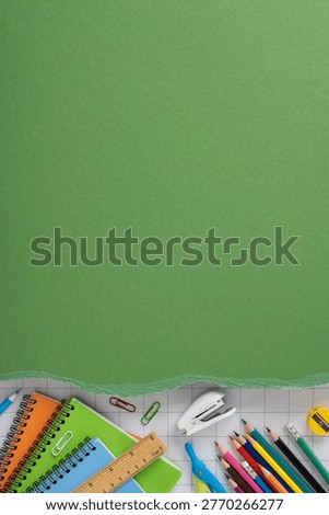 Back to school flat lay featuring notebooks, pencils, ruler and assorted stationery on a green textured background ideal for education, study, classroom and school project visuals