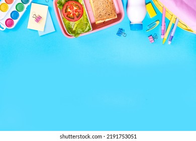 Back To School Flatlay Background. Pink Pencil Case With Various School Stationery On High-colored Bright Background